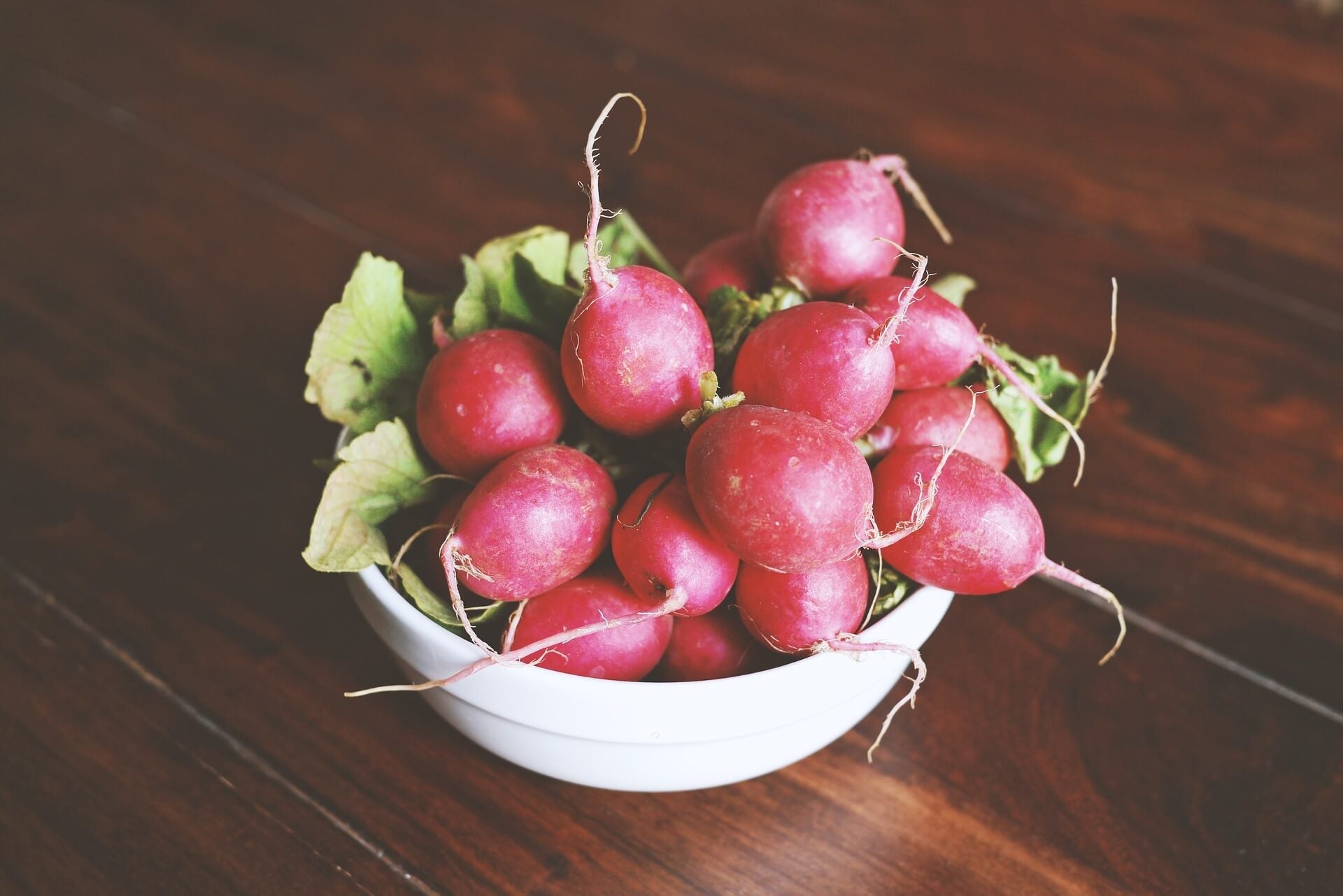 Bowl of red crunchy radishes for salad