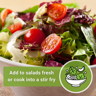 a salad with some large red cherry tomatoes in it add to salads fresh or cook into a stir fry